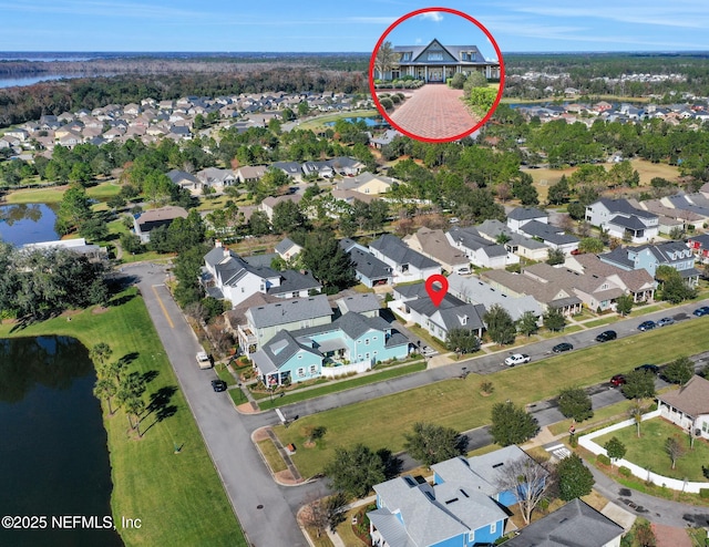 birds eye view of property featuring a water view