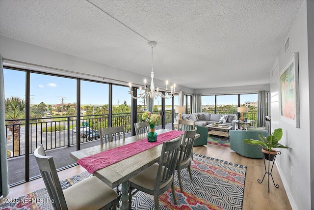 7870 A1A S Unit 209, Saint Augustine, FL 32080 - sunroom with a chandelier