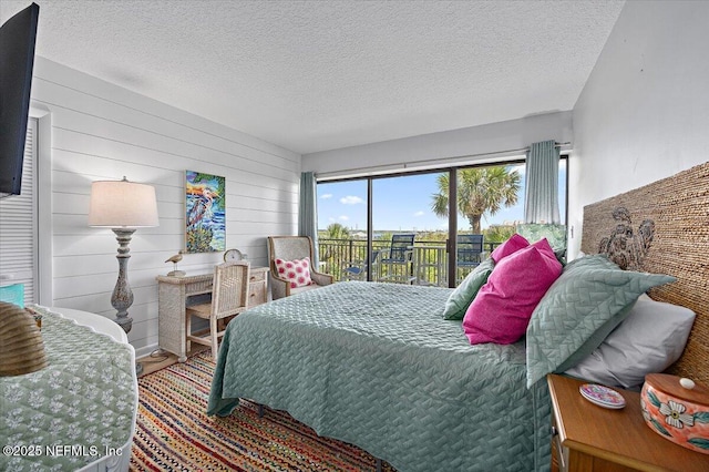 7870 A1A S Unit 209, Saint Augustine, FL 32080 - bedroom with access to outside and a textured ceiling