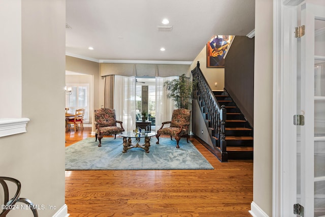 interior space featuring recessed lighting, stairway, ornamental molding, and wood finished floors