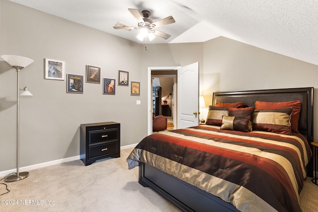 bedroom with baseboards, ceiling fan, vaulted ceiling, a textured ceiling, and light colored carpet