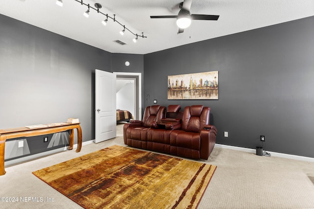 living room with visible vents, a ceiling fan, carpet, and baseboards