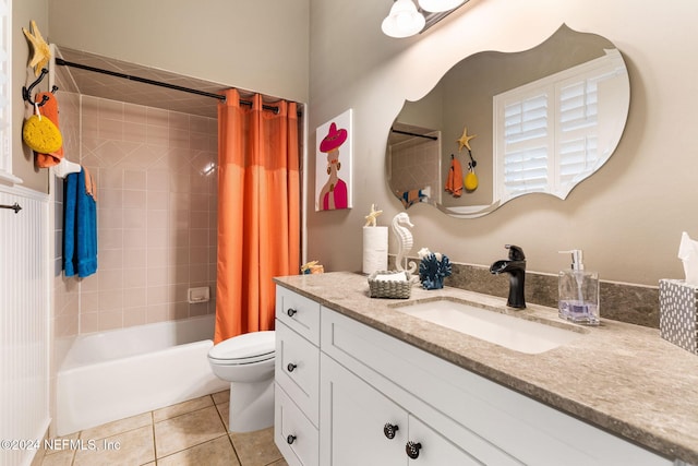 bathroom with tile patterned floors, vanity, toilet, and shower / tub combo