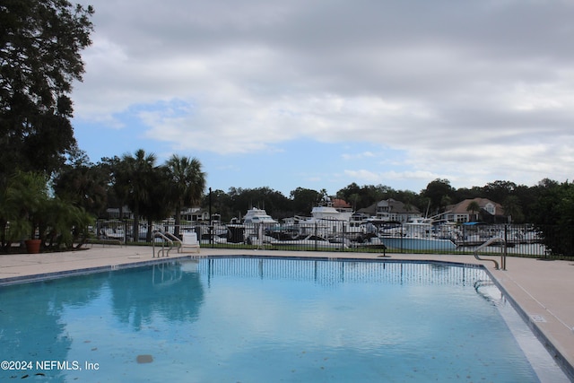 community pool featuring fence