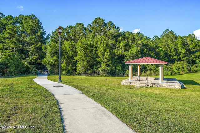 view of community featuring a gazebo and a yard