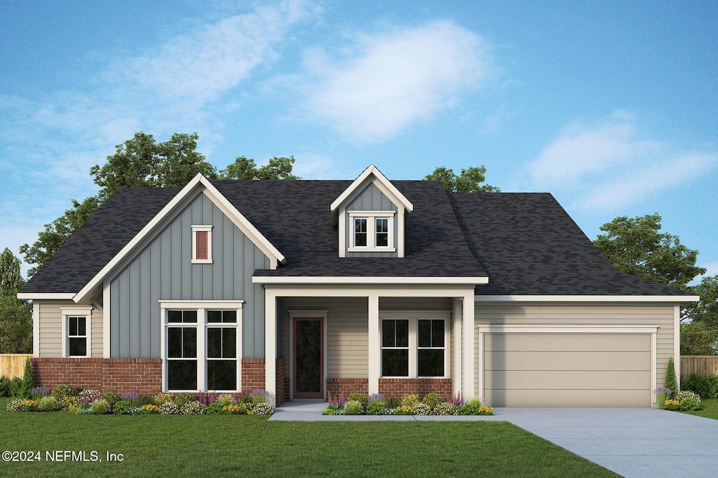 view of front facade featuring a front yard and a garage