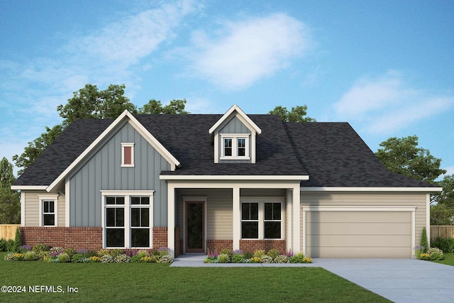 view of front facade featuring a front yard and a garage