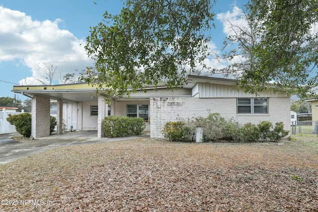 single story home with a carport