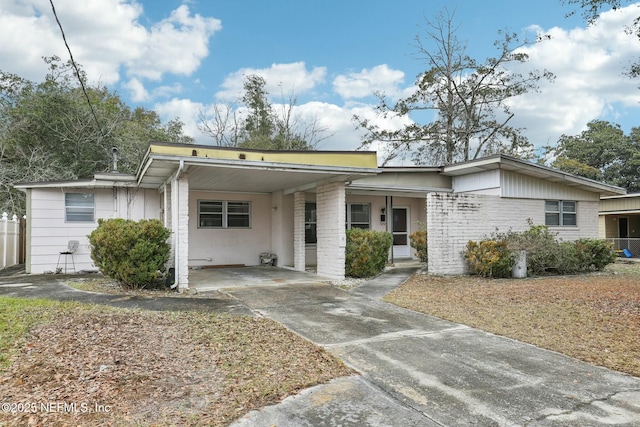 single story home featuring a carport