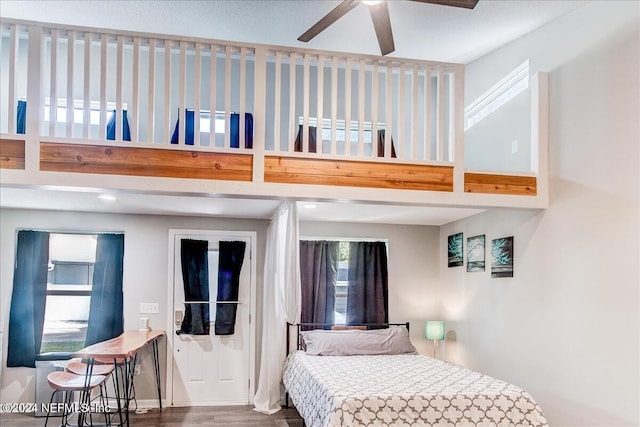 bedroom with ceiling fan and dark hardwood / wood-style floors