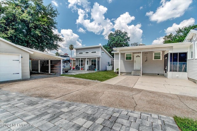 view of front of house with an outbuilding and a garage