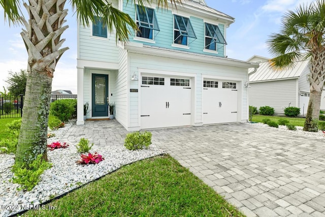 view of front of property featuring a garage