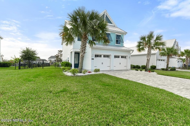 view of front facade with a front lawn and a garage