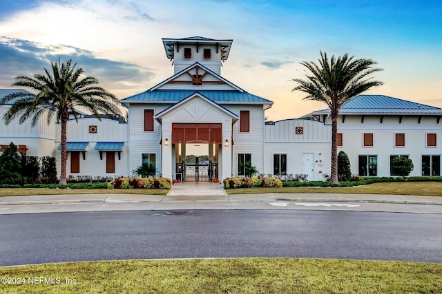 view of outdoor building at dusk