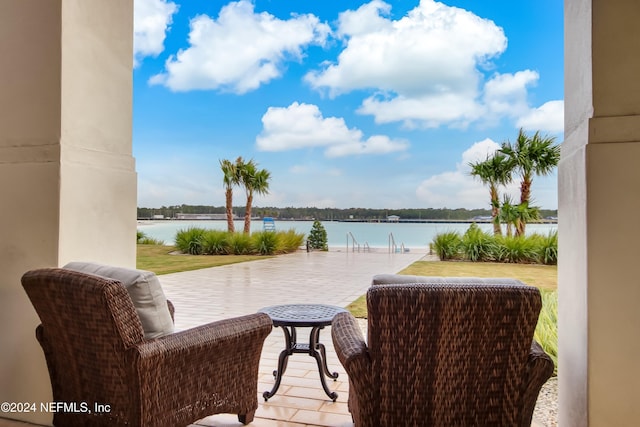 view of patio featuring a water view