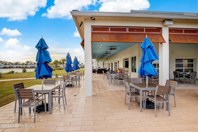 view of patio featuring ceiling fan