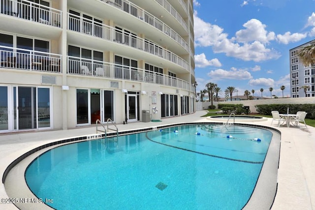 view of pool featuring a patio