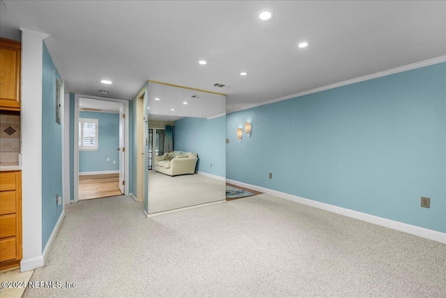 unfurnished bedroom with light carpet and crown molding