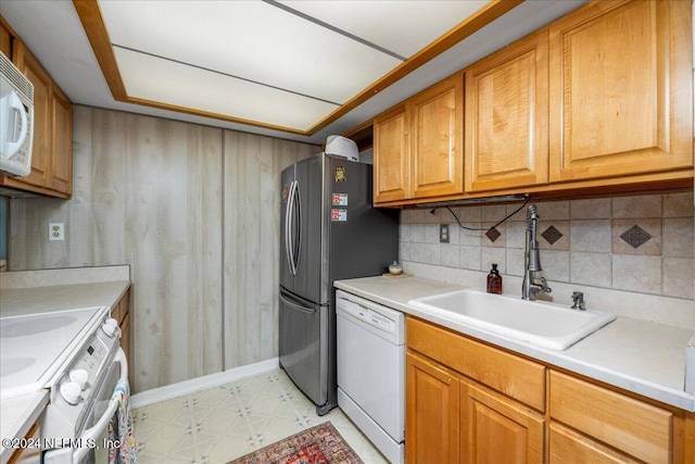 kitchen featuring sink and white appliances