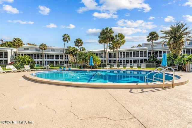 view of pool featuring a patio