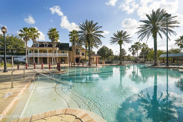 view of swimming pool featuring a patio