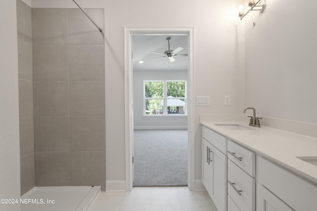 bathroom featuring tile patterned floors, ceiling fan, and vanity