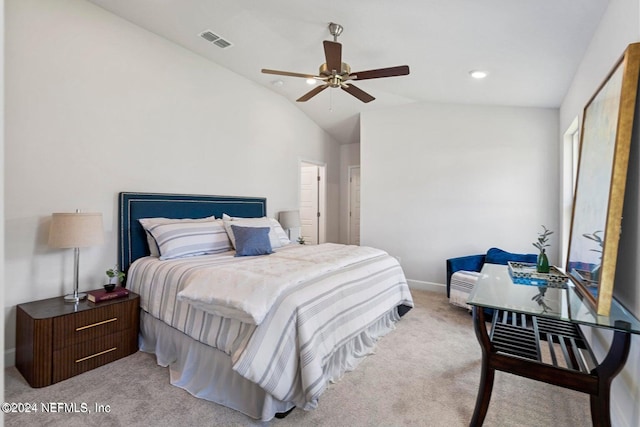 bedroom featuring ceiling fan, light colored carpet, and lofted ceiling