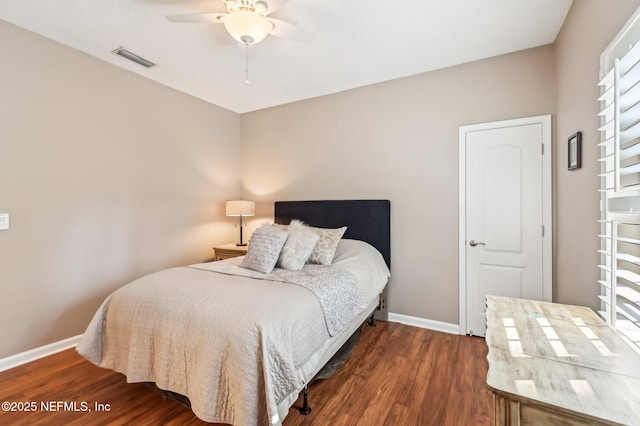 bedroom featuring ceiling fan and dark wood-type flooring