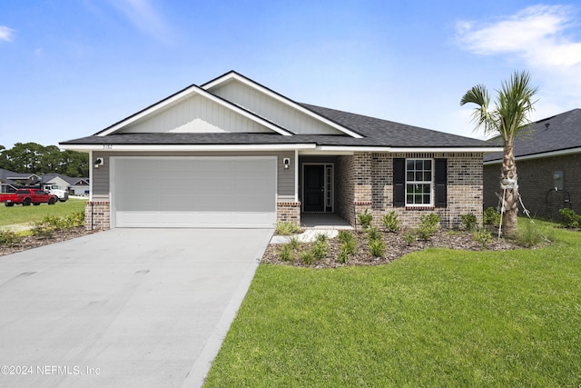 view of front facade with a garage and a front lawn