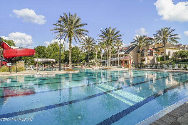 view of swimming pool featuring a water slide