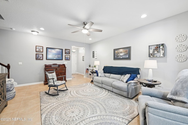 tiled living room with ceiling fan