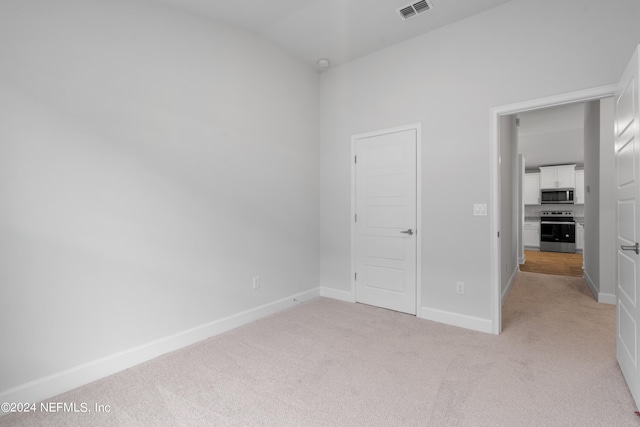 unfurnished bedroom with light carpet