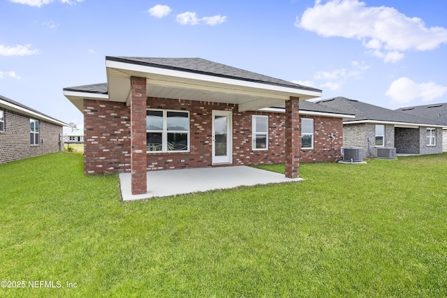 3245 Winding Creek Pl, Green Cove Springs, FL 32043 - rear view of property with central AC unit, a yard, and a patio area