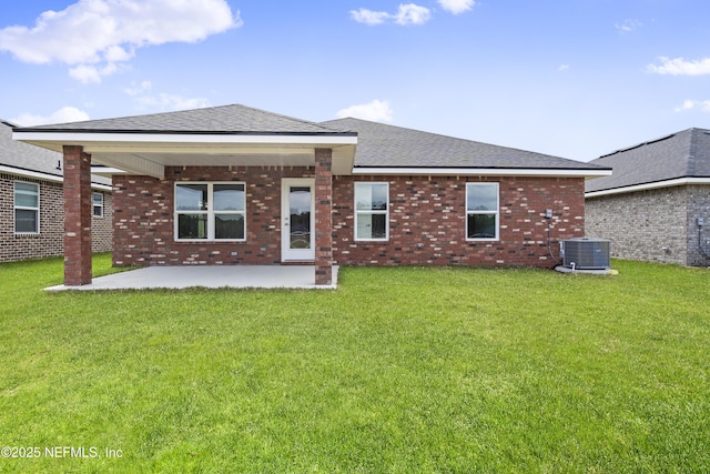 3245 Winding Creek Pl, Green Cove Springs, FL 32043 - rear view of property with brick siding, central air condition unit, a yard, and a patio area