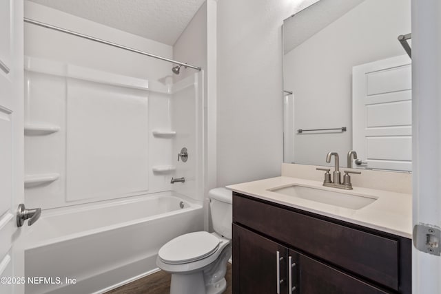 3245 Winding Creek Pl, Green Cove Springs, FL 32043 - full bath with toilet, vanity, wood finished floors, a textured ceiling, and tub / shower combination