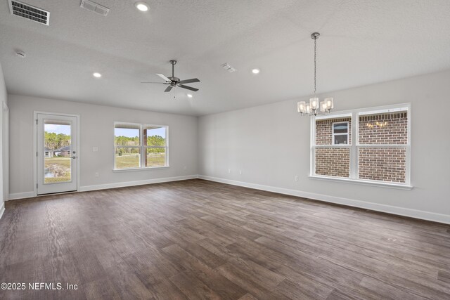 3245 Winding Creek Pl, Green Cove Springs, FL 32043 - empty room featuring dark wood-style floors, visible vents, baseboards, and ceiling fan with notable chandelier