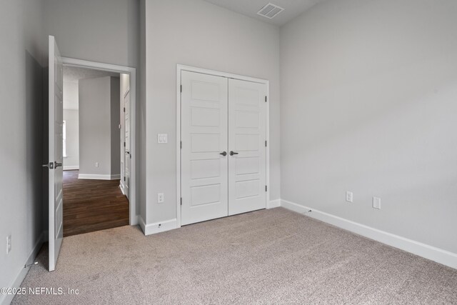 3245 Winding Creek Pl, Green Cove Springs, FL 32043 - unfurnished bedroom with carpet floors, baseboards, a closet, and visible vents
