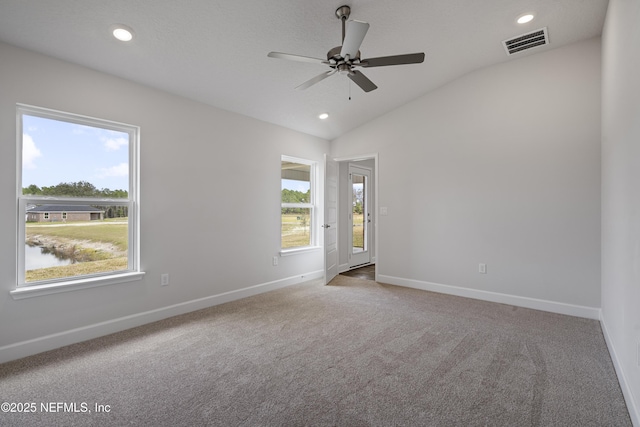 3245 Winding Creek Pl, Green Cove Springs, FL 32043 - spare room with carpet floors, a ceiling fan, lofted ceiling, baseboards, and visible vents
