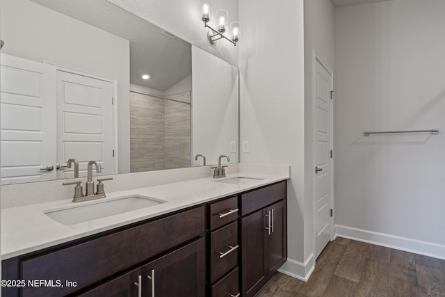 3245 Winding Creek Pl, Green Cove Springs, FL 32043 - full bath with double vanity, wood finished floors, baseboards, and a sink