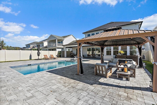 view of swimming pool with a gazebo, a patio area, and an outdoor hangout area