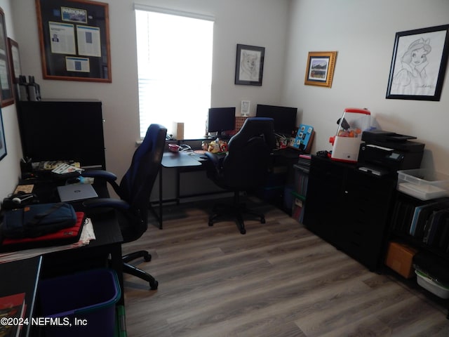 home office with wood-type flooring