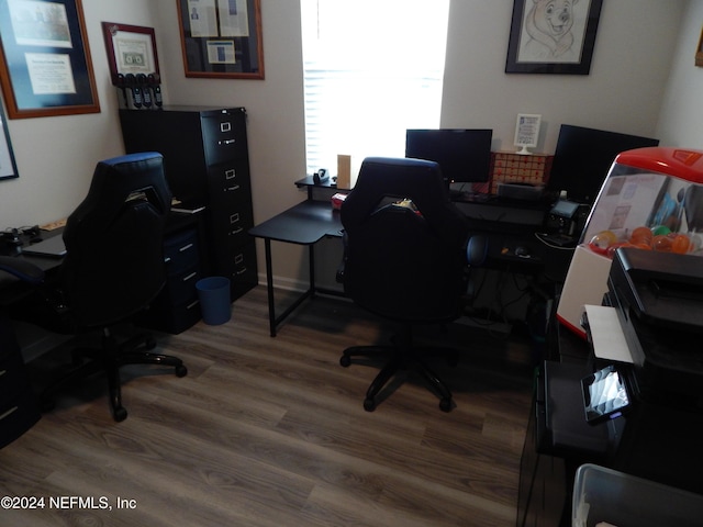 home office with hardwood / wood-style flooring