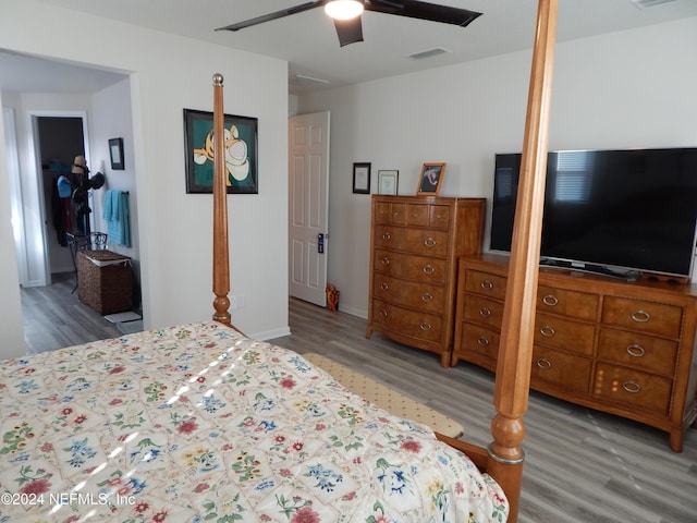 bedroom with hardwood / wood-style floors and ceiling fan