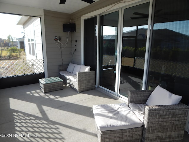 balcony with ceiling fan, a patio, and an outdoor hangout area