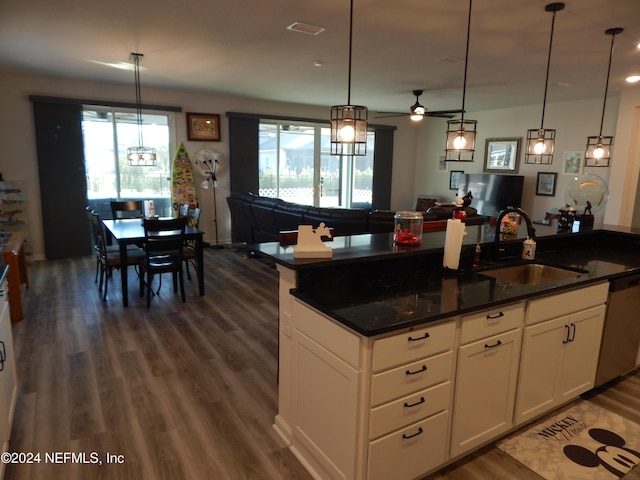 kitchen with ceiling fan, sink, white cabinets, and plenty of natural light