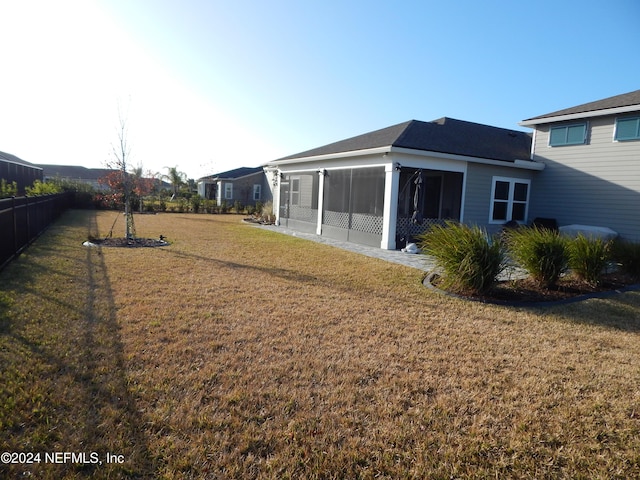 view of yard featuring a sunroom