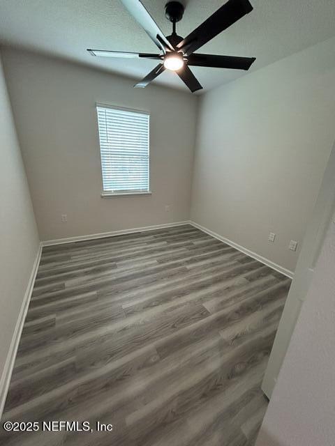 85431 Apple Canyon Ct, Fernandina Beach, FL 32034 - empty room featuring wood finished floors and ceiling fan
