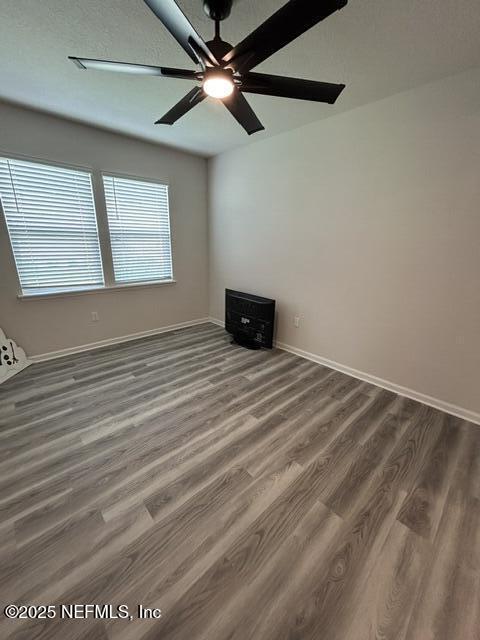 85431 Apple Canyon Ct, Fernandina Beach, FL 32034 - spare room featuring wood finished floors and ceiling fan
