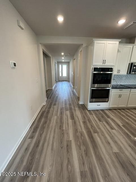 85431 Apple Canyon Ct, Fernandina Beach, FL 32034 - hallway featuring dark wood-style floors and recessed lighting