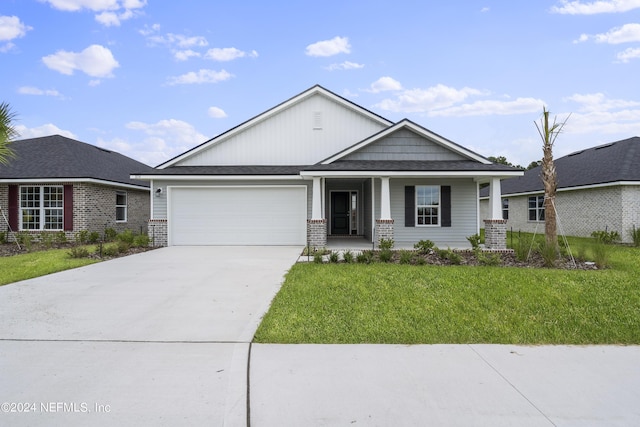 3339 Meadow Ridge Pl, Green Cove Springs, FL 32043 - view of front of home with a porch, a garage, and a front lawn